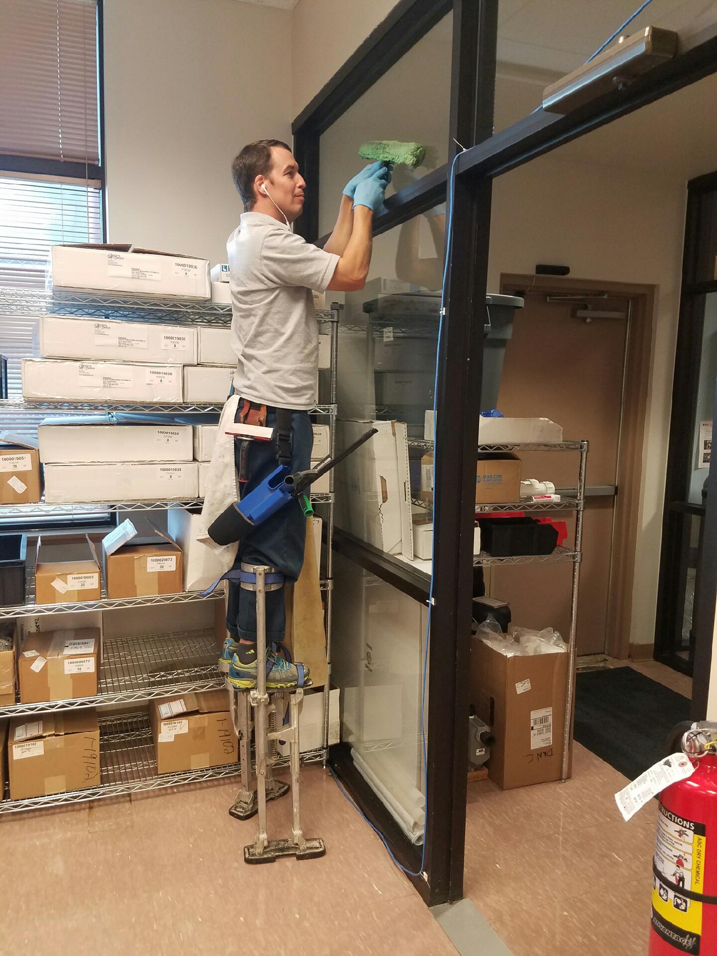 Crystal clear residential windows cleaned by WellDone Windows Lakeville showing neighborhood view with spotless glass