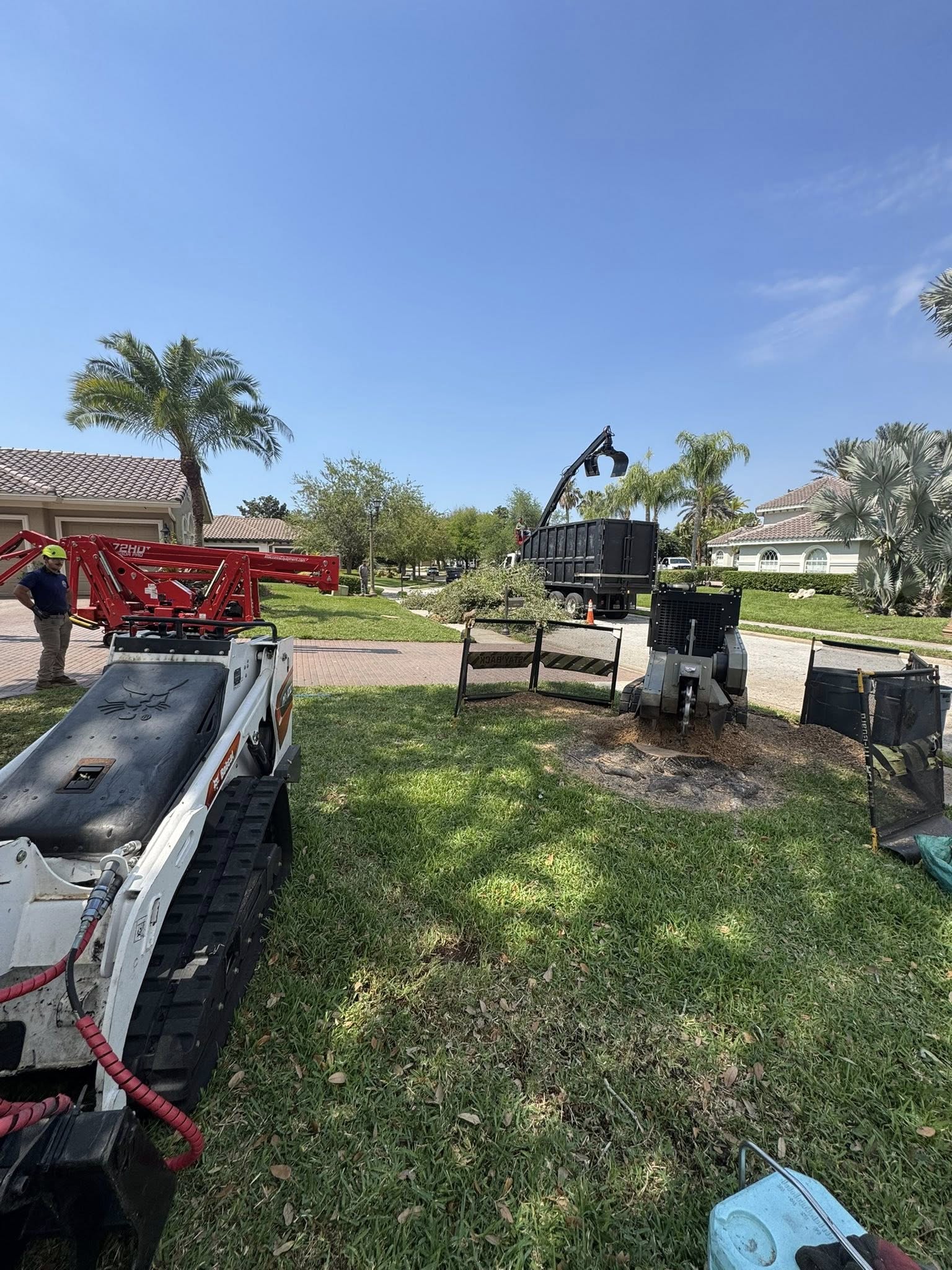 A group of people walking across a street