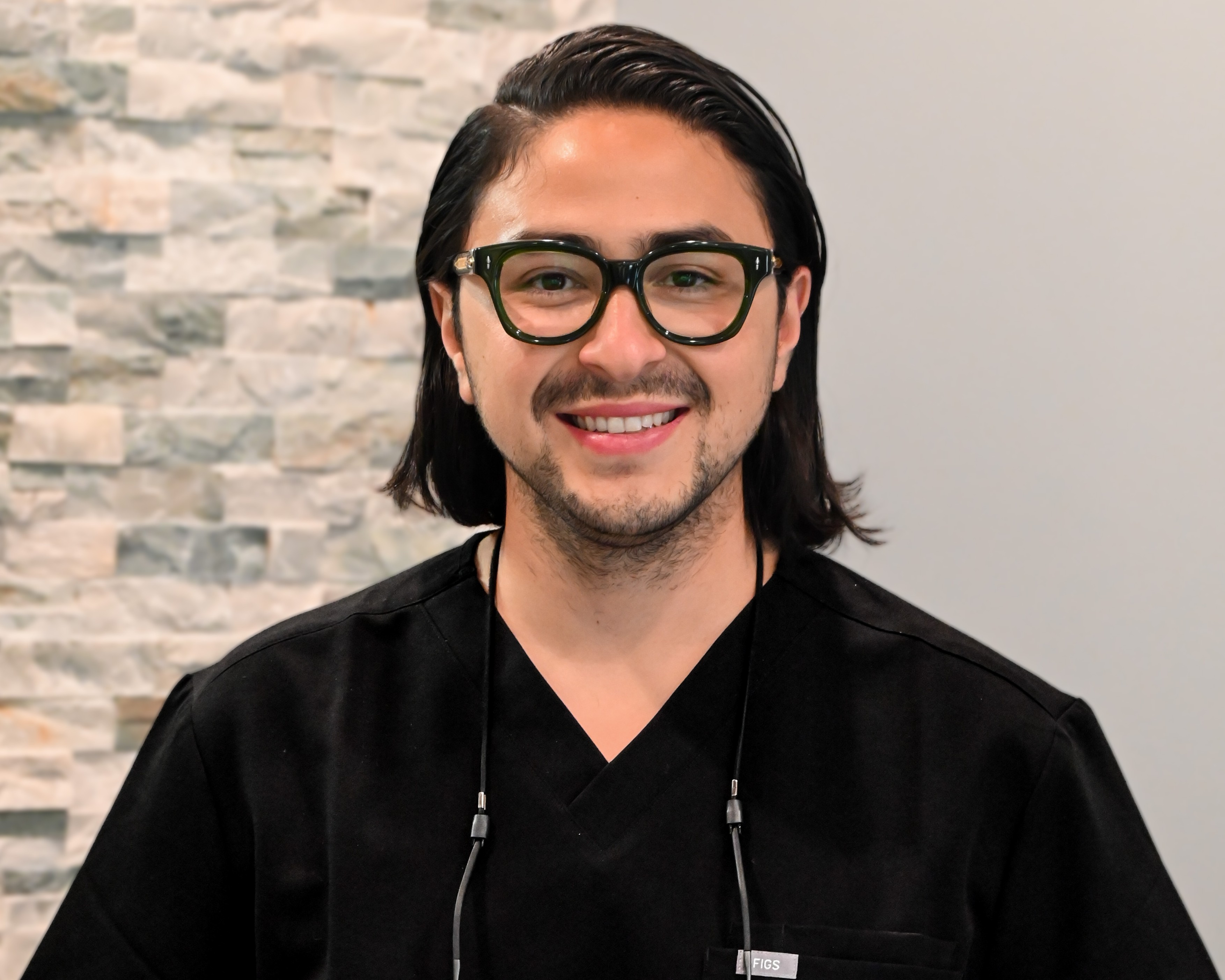 Local dentist smiling in the practice