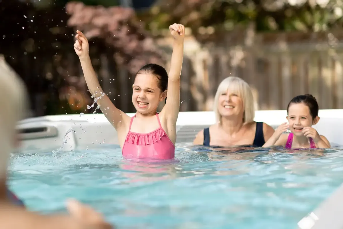 happy girl in hydropool swim spa
