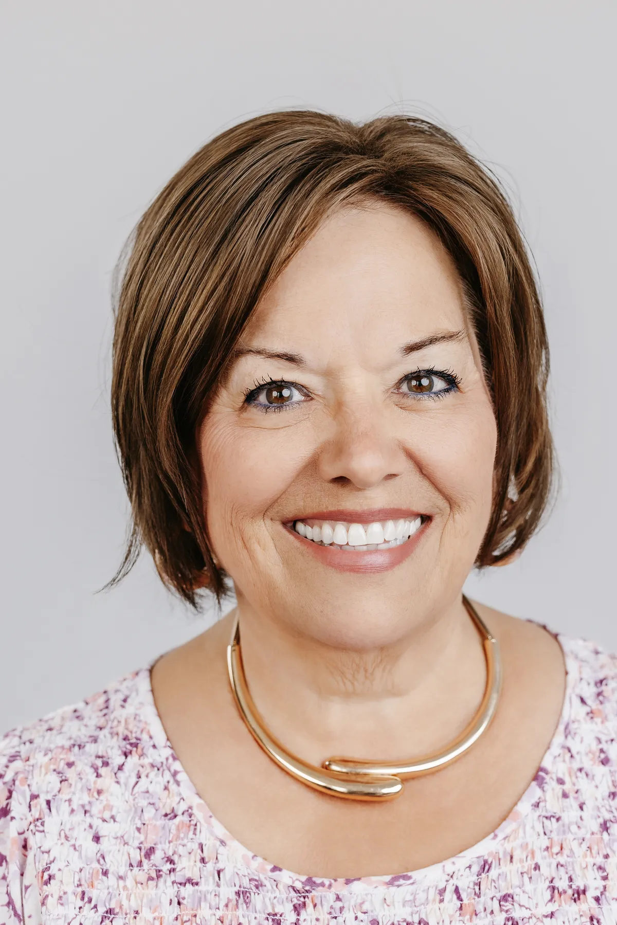 Editorial portrait of Kathy Cormier, Founder of The New Road and Transformational Life Coach