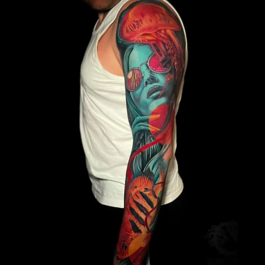 Colour tattoo sleeve by Santo Cuervo Tattoo Collective