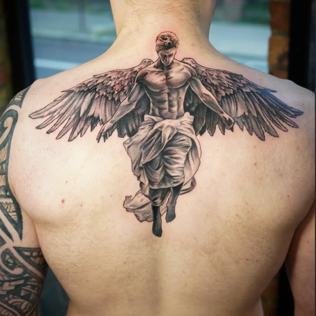 Back piece tattoo by Santo Cuervo Tattoo Collective