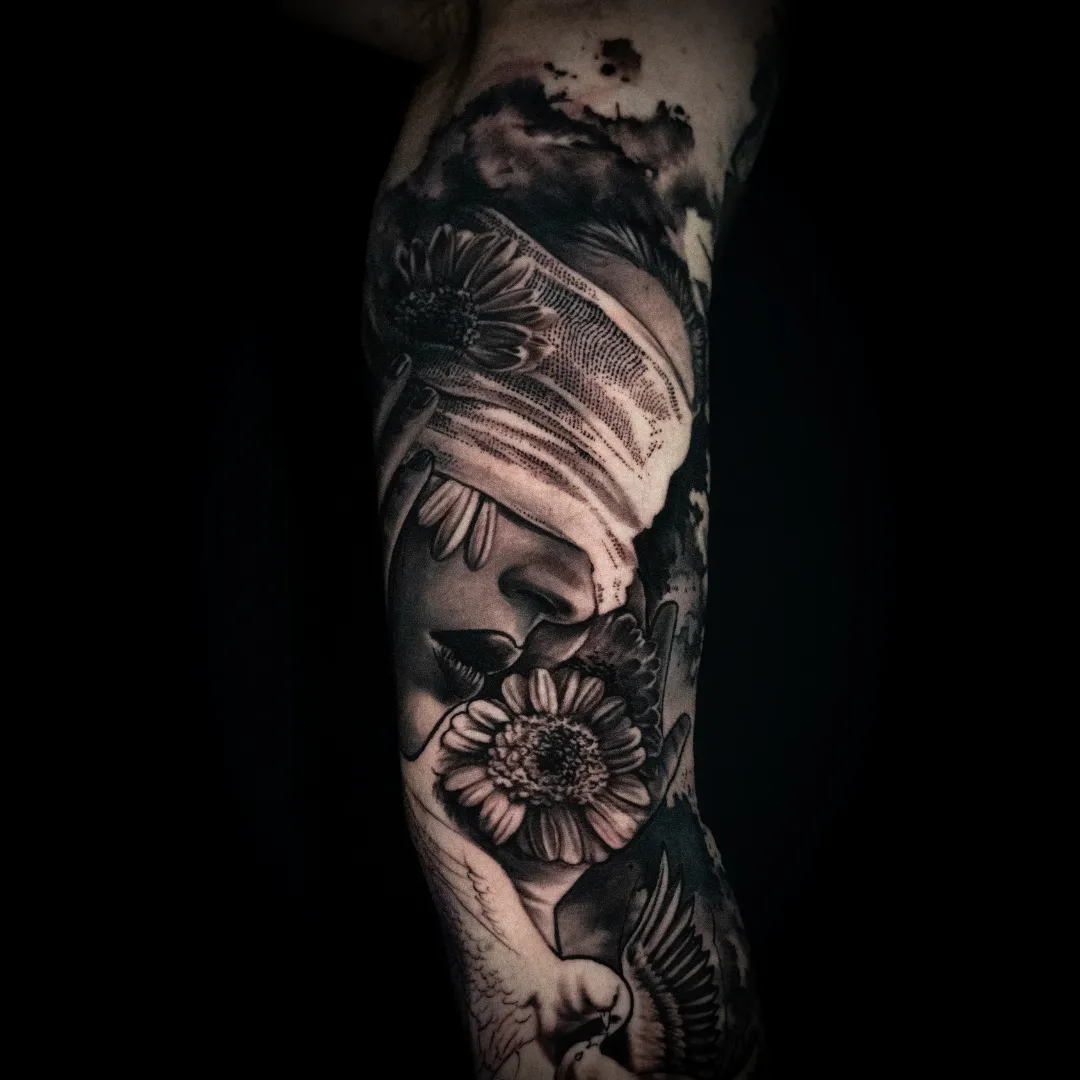 Black and grey tattoo sleeve by Santo Cuervo Tattoo Collective