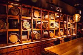 photo of person holding glass bottle