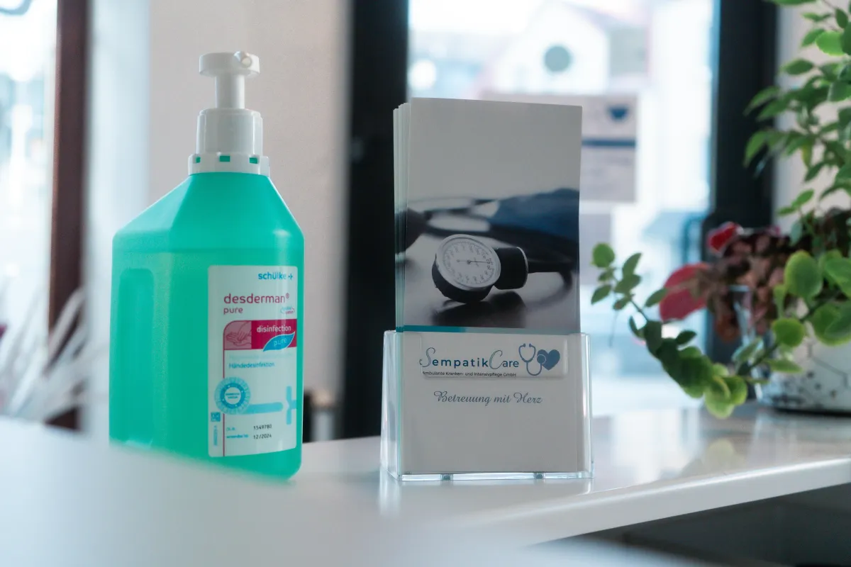 man in black and white jacket holding white and black cat