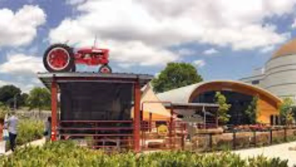 Families exploring the GROW outdoor agriculture exhibit