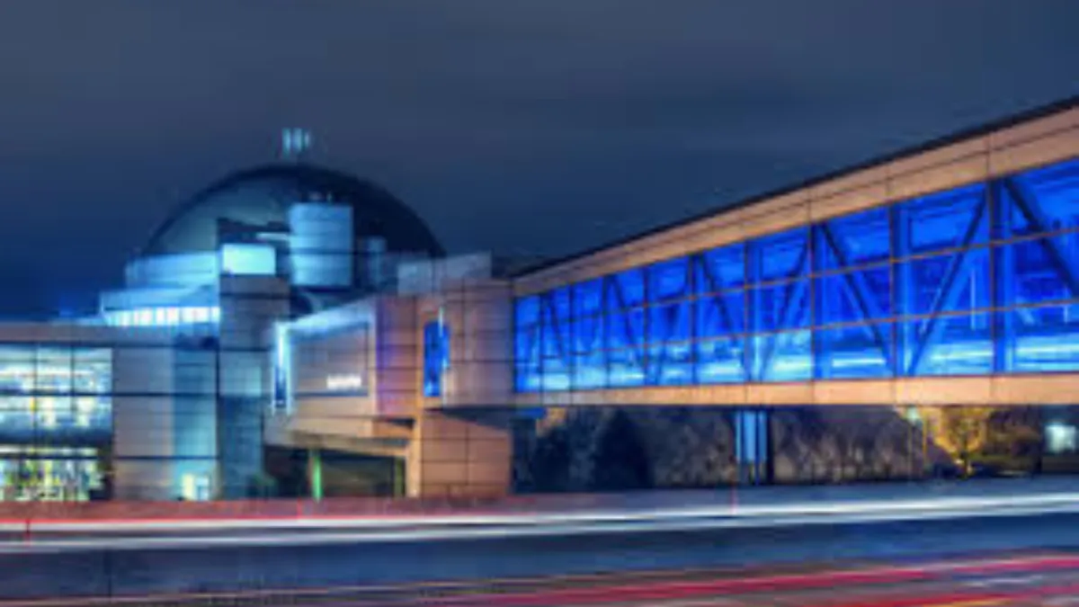 People walking across the Skybridge over the highway