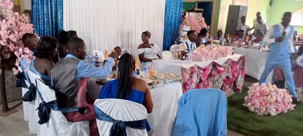Liberian catering setup with decorated tables and traditional food