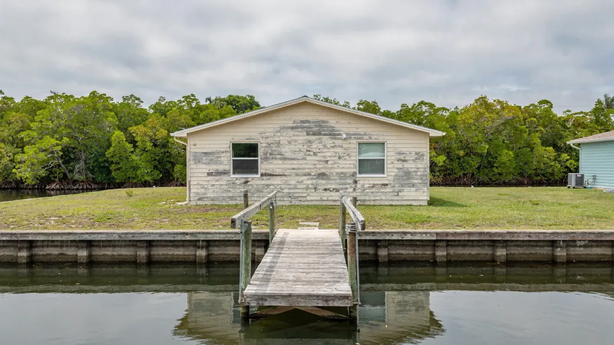 Canal-front home with dock and boat lift in Port St. Lucie, St. Lucie County, Florida