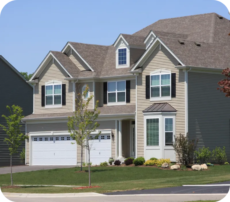 Two-story suburban home under clear blue sky featured for a home inspection in Wilmington, DE.