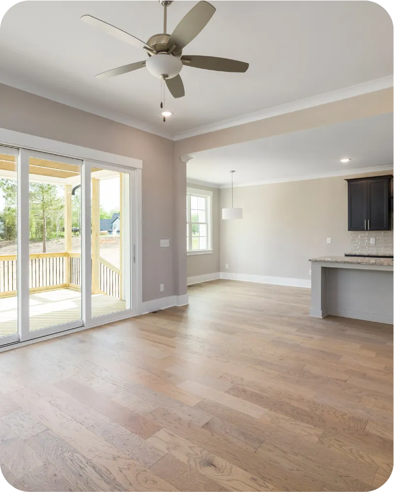 Spacious Delaware home interior with ceiling fan, windows, and doors ideal for inspection of structure and insulation.