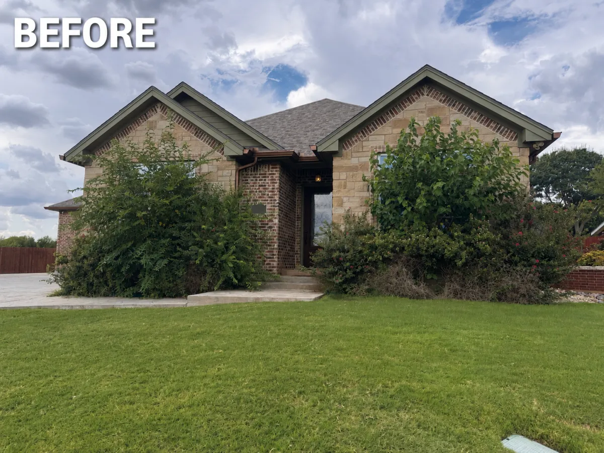 Before image of front yard cleanup and shrub trimming project in Abilene TX by Mow & Glow Lawn Services