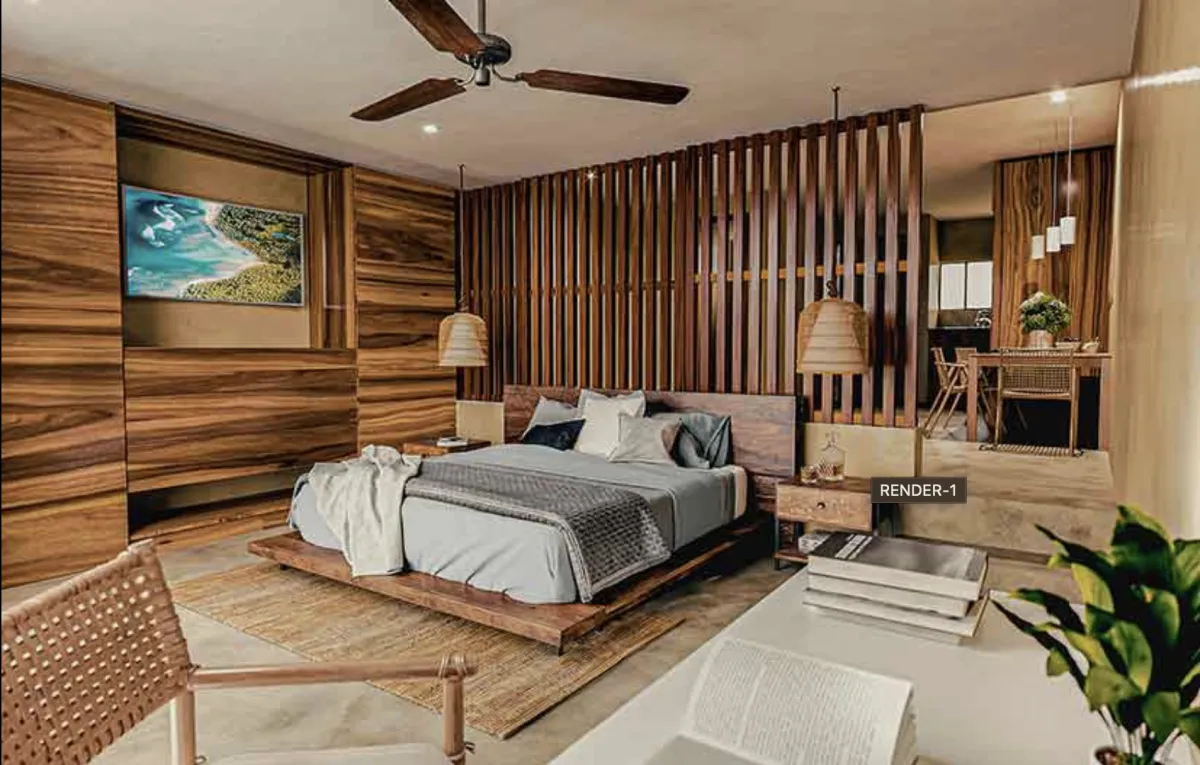 Pink historic hotel by the ocean with palm trees