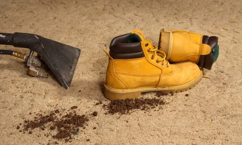 Young woman with volunteers cleaning beach with blue bags