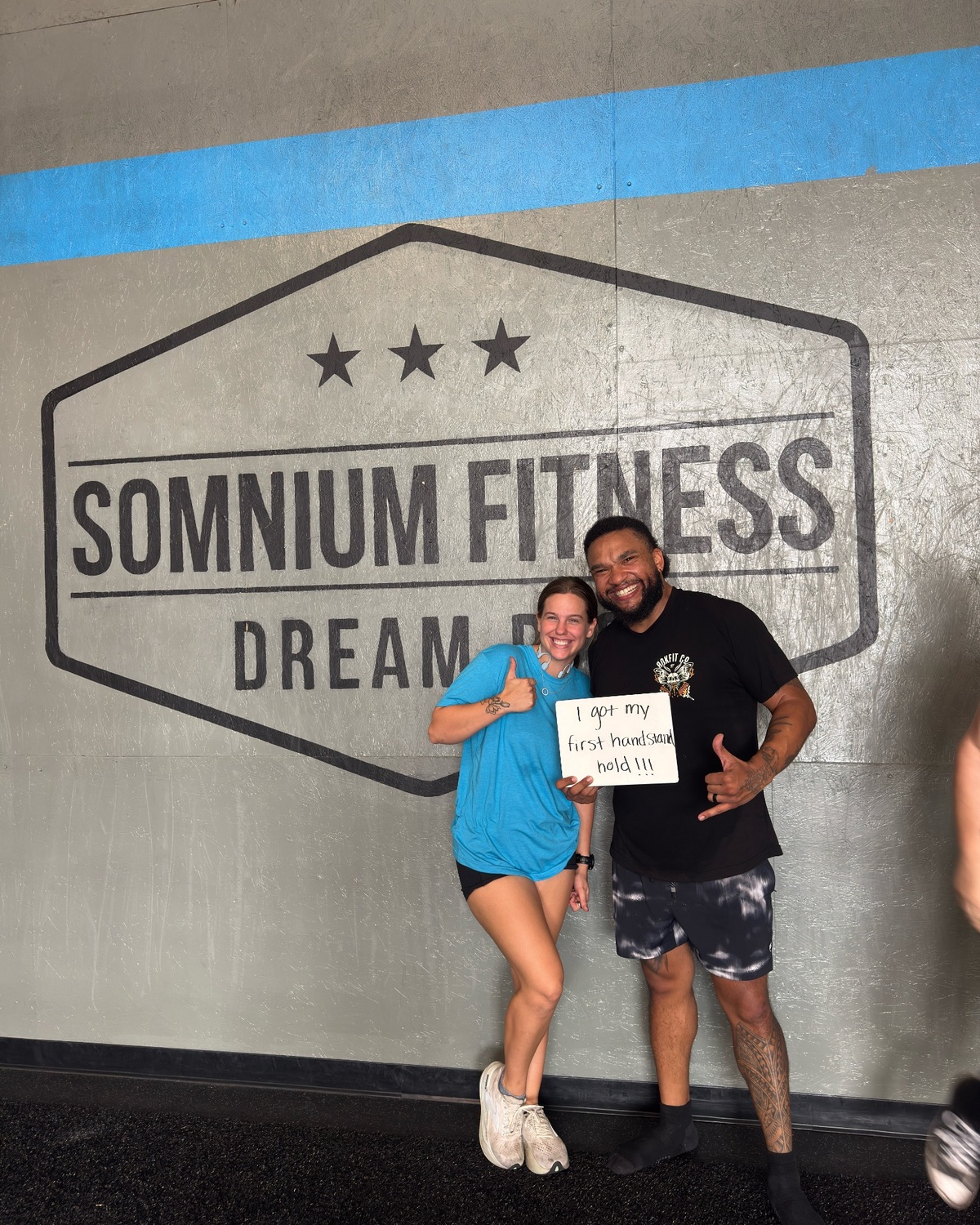 Somnium Fitness member David celebrating his first handstand hold