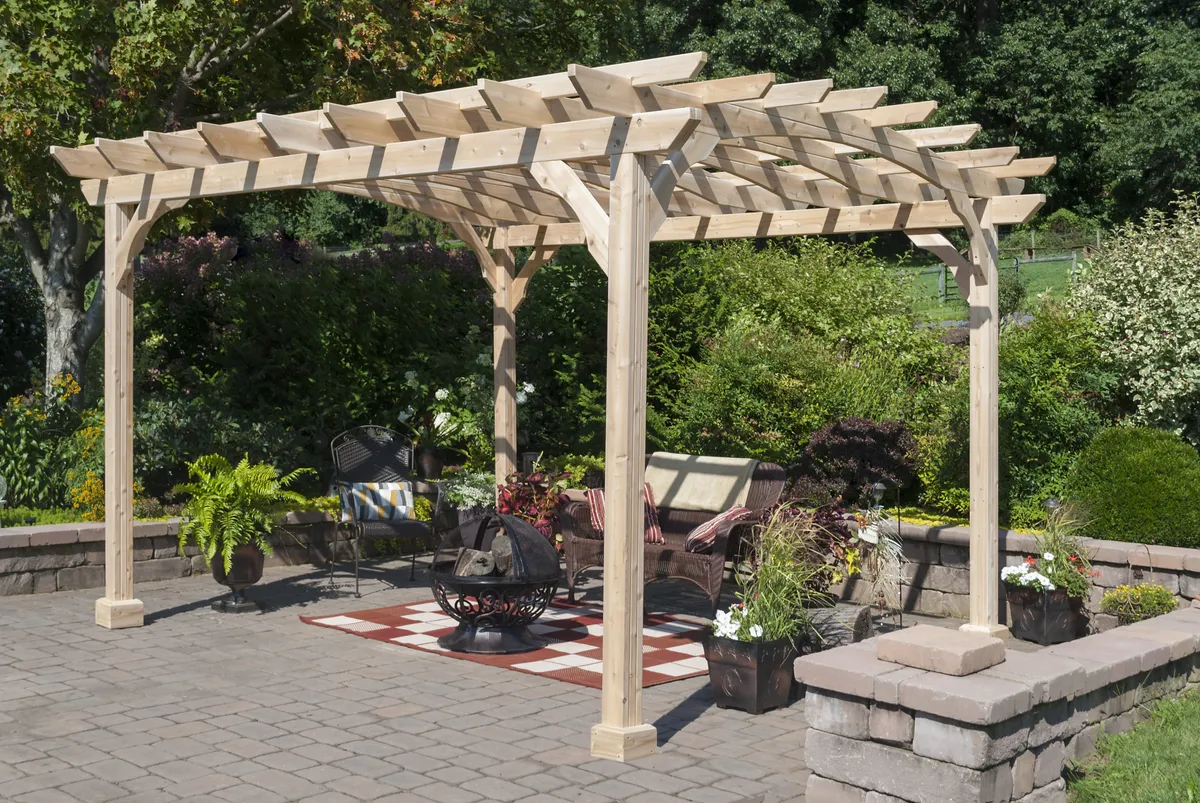 Cedar pergola over a paver patio with a fire pit and planters | Prime Decks Delaware, serving Middletown, DE