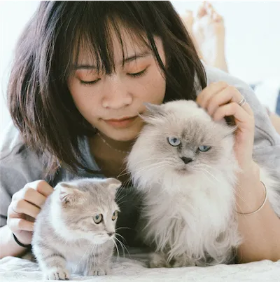 woman with two cats