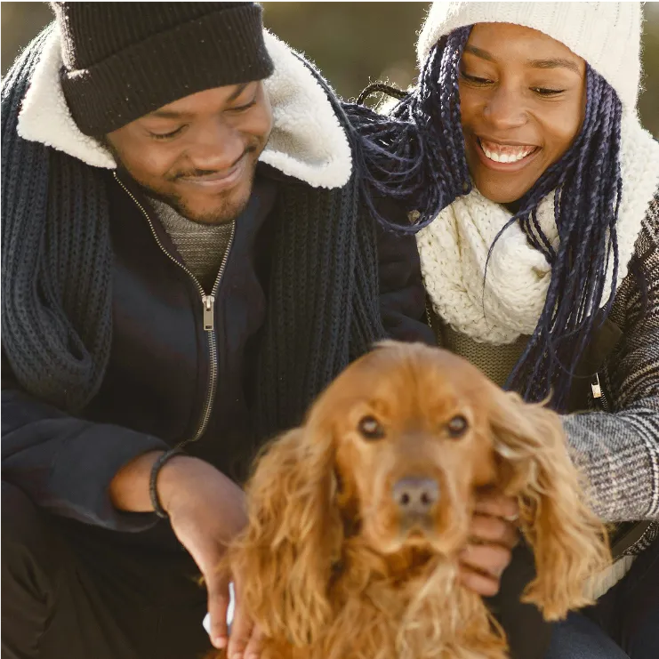happy couple with a dog