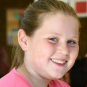 smiling girl in a pink t-shirt