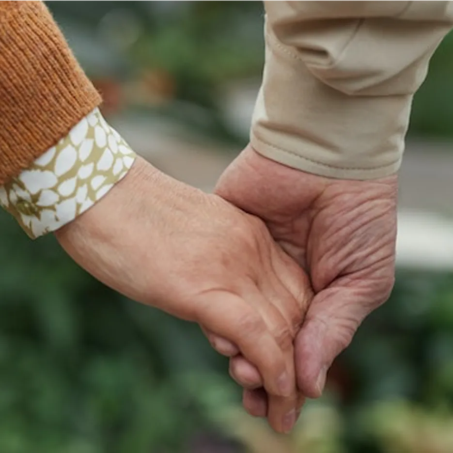 a man and woman holdig hands