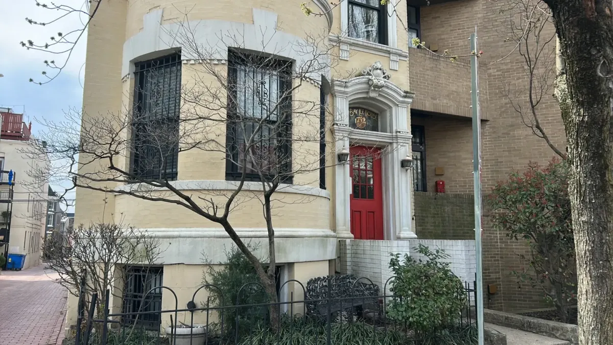 black and white cocnrete building low-angle photography