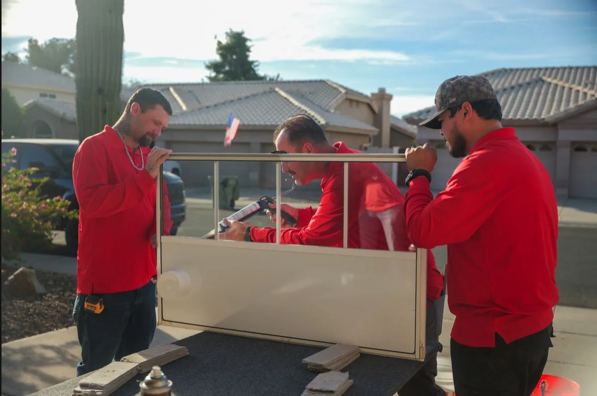 Euro Glass team carrying a custom AC Ports panel