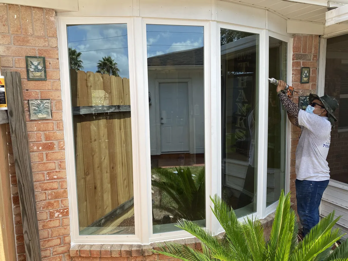 Installer fitting a new bay window