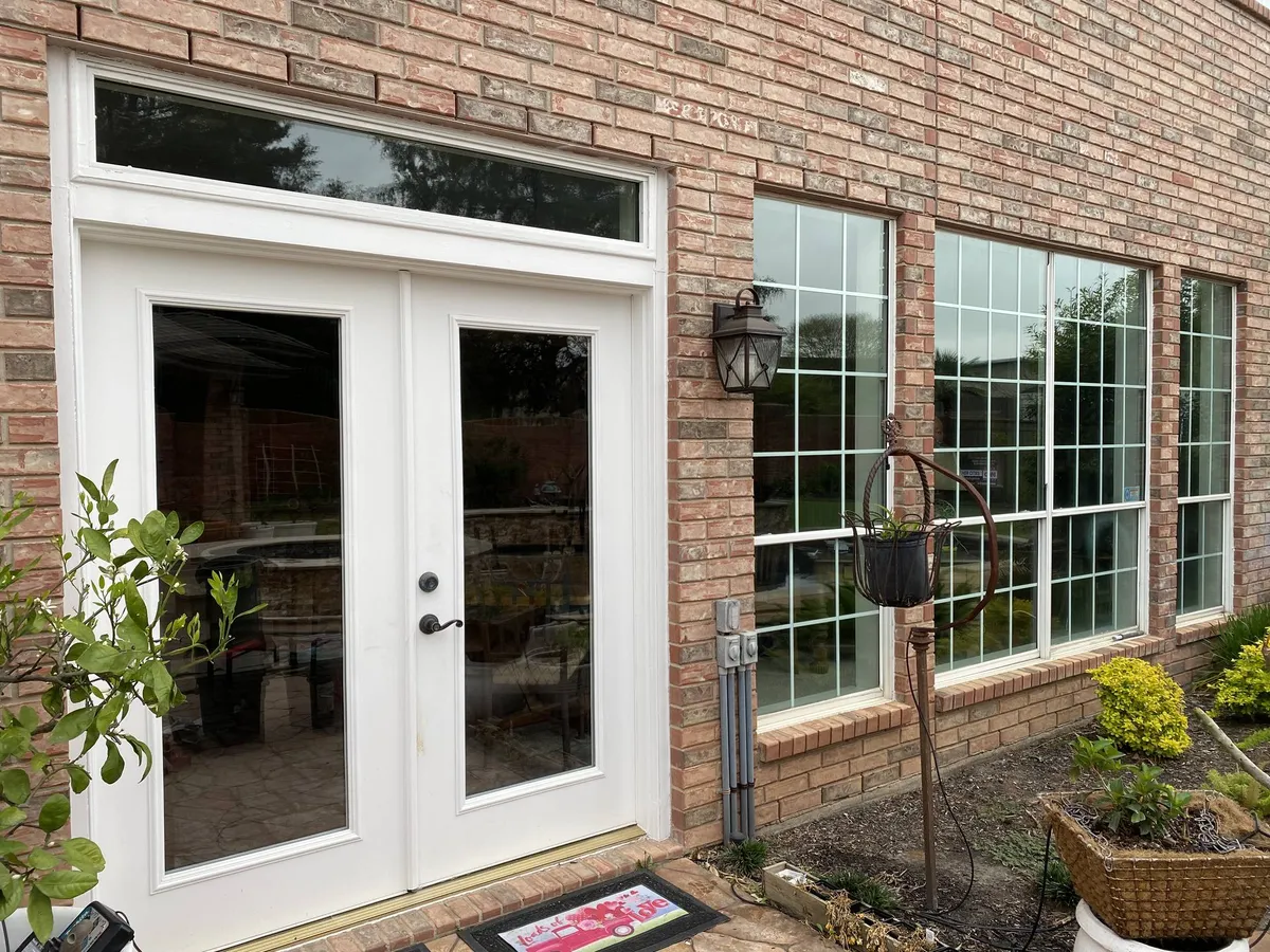 Replacement windows and French doors on a brick home