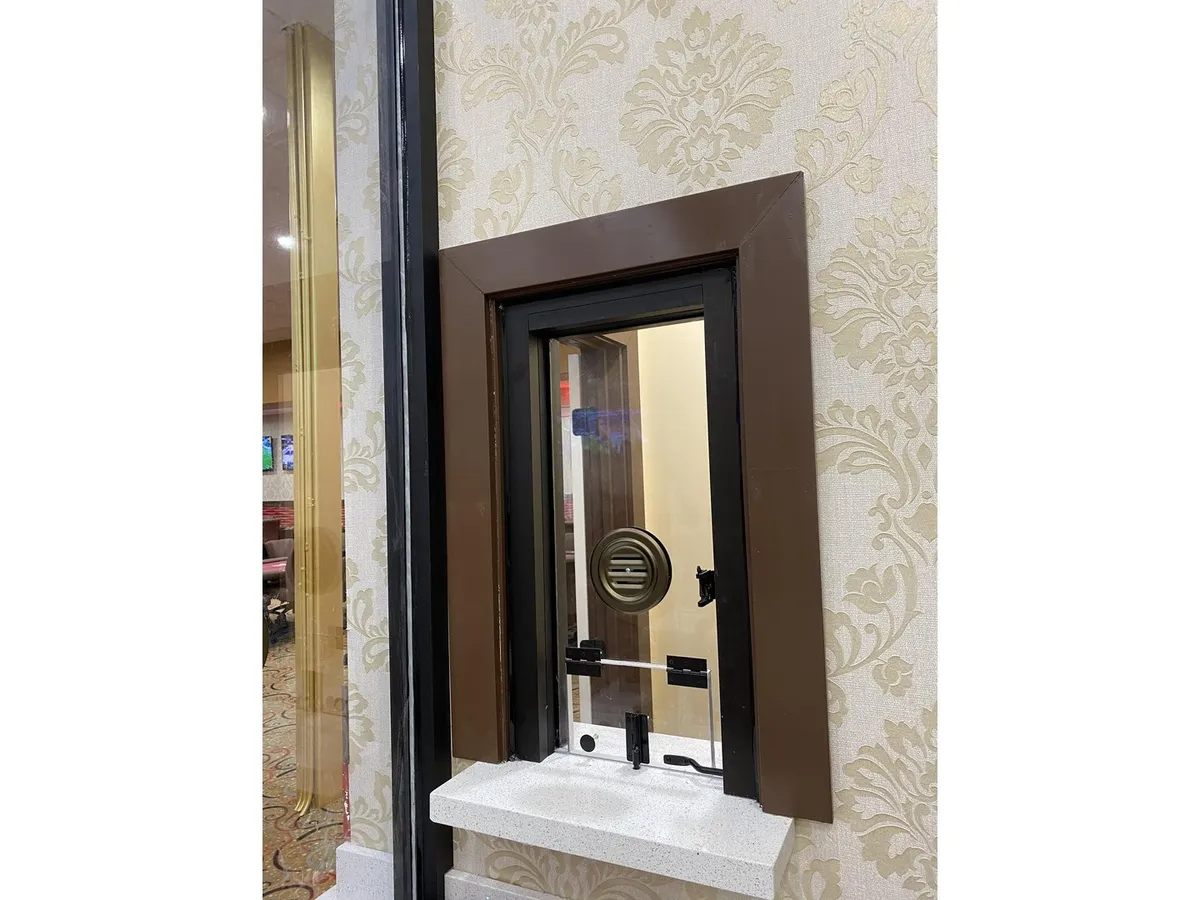 Bullet-resistant service window with speak-through