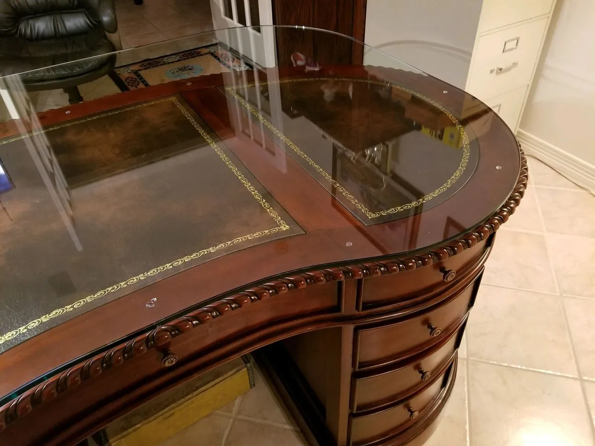 Custom glass top on a curved desk