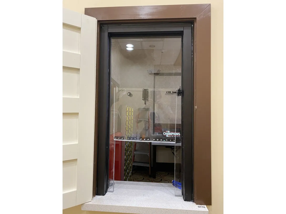 Bullet resistant transaction window with dark frame