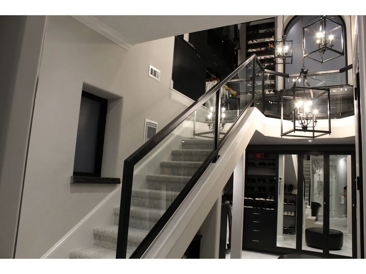 Frameless glass stair railing in a luxury home