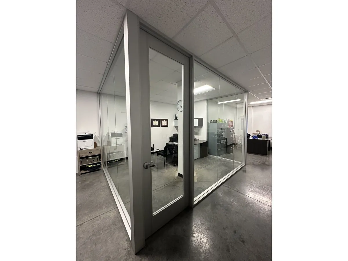 Framed glass office partition and door
