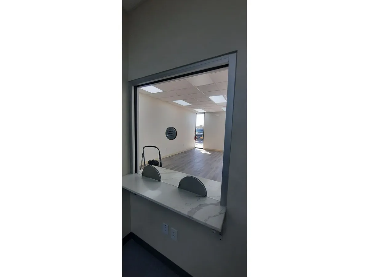Glass service window with transaction counter