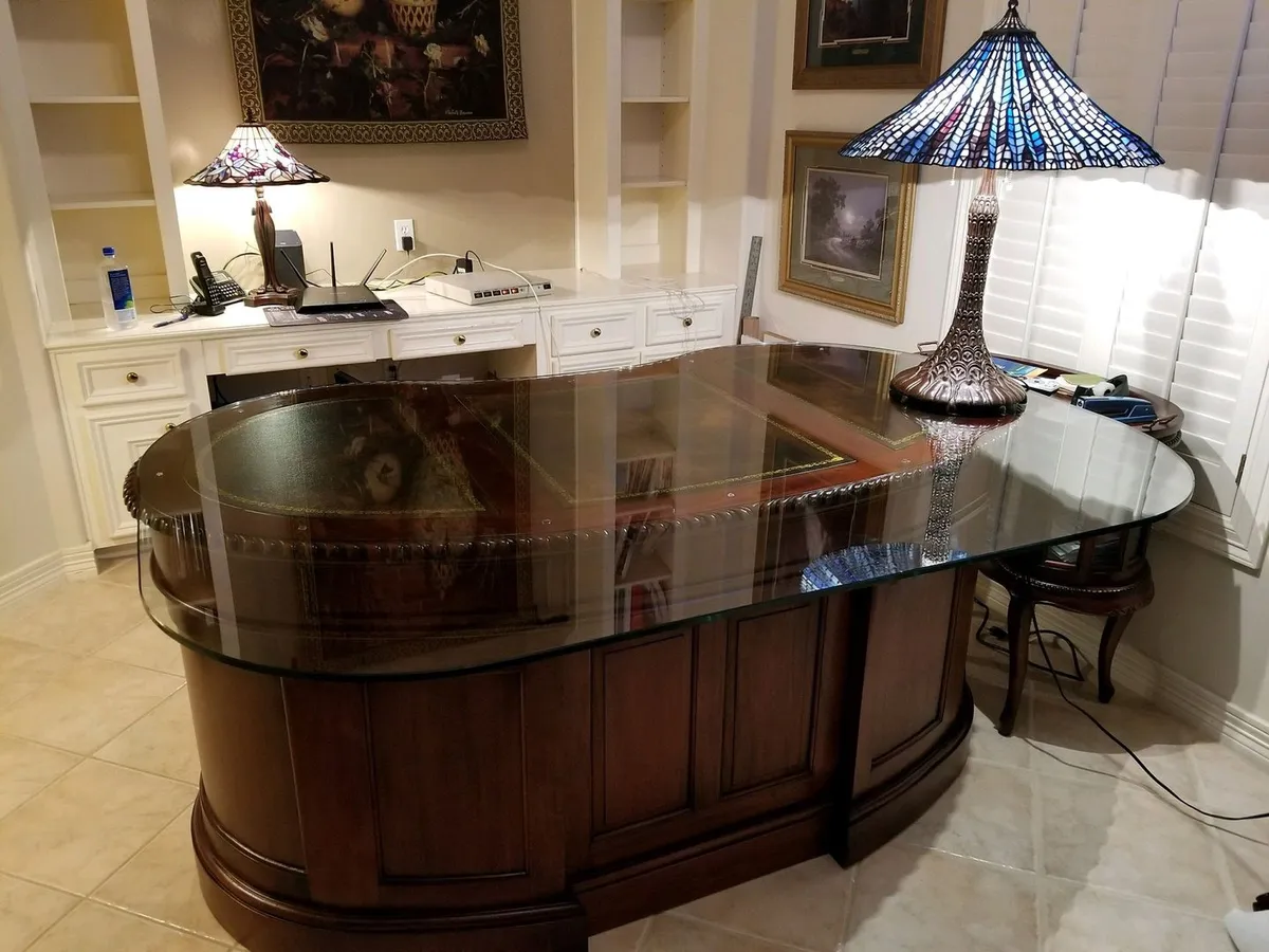 Glass top protecting a wood desk