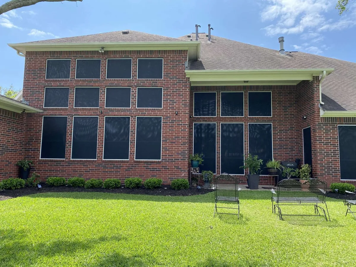 Home exterior with solar screens on all windows