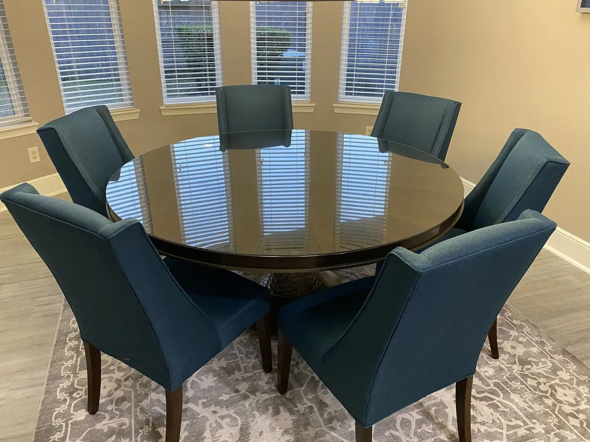 Round glass table top on a dining table