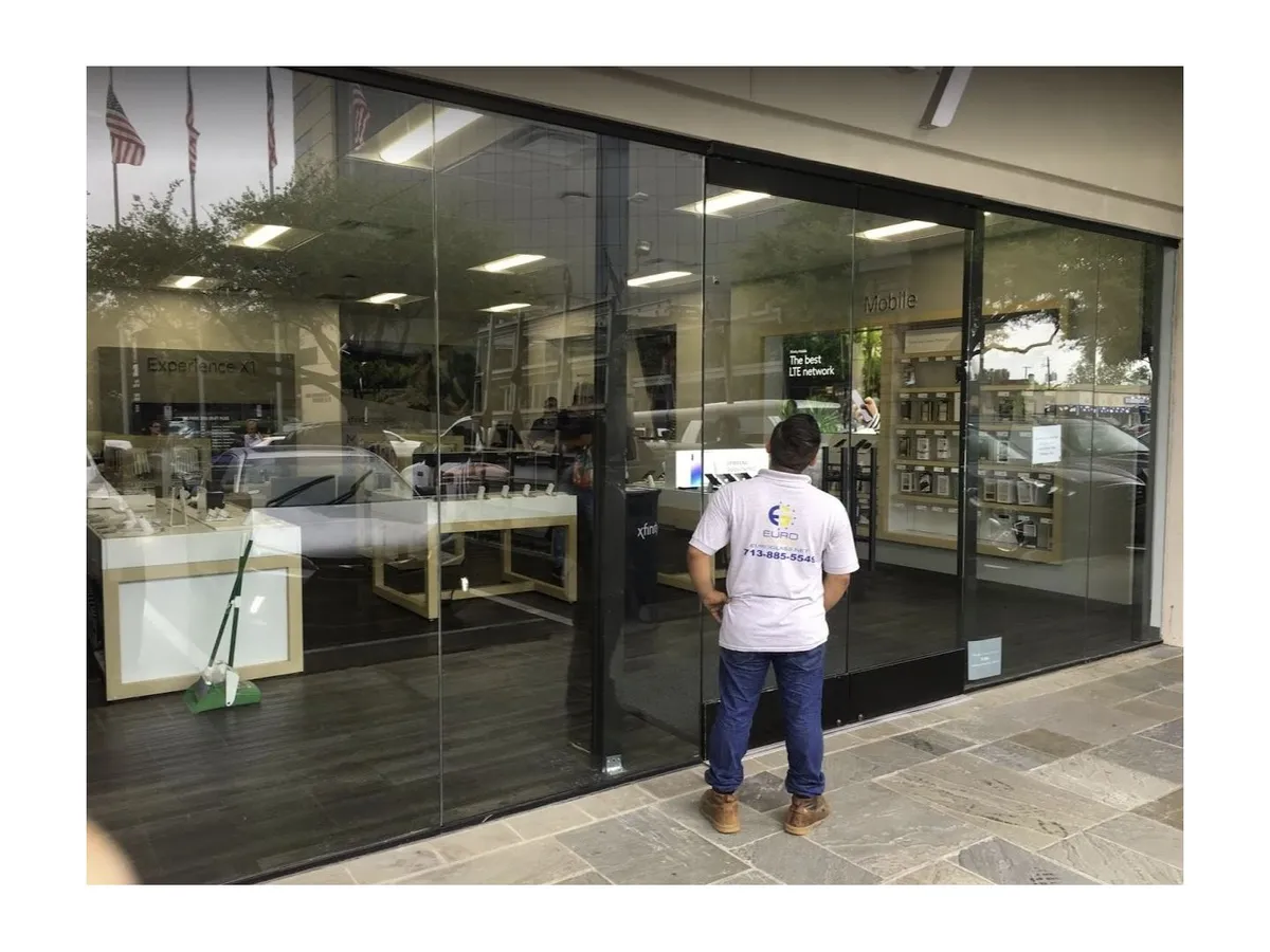 Technician inspecting a new aluminum storefront