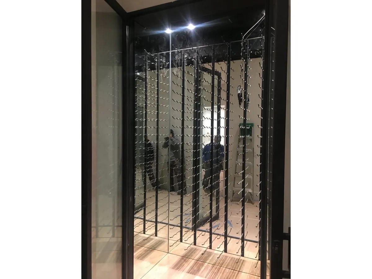 Wine cellar glass doors with metal racks