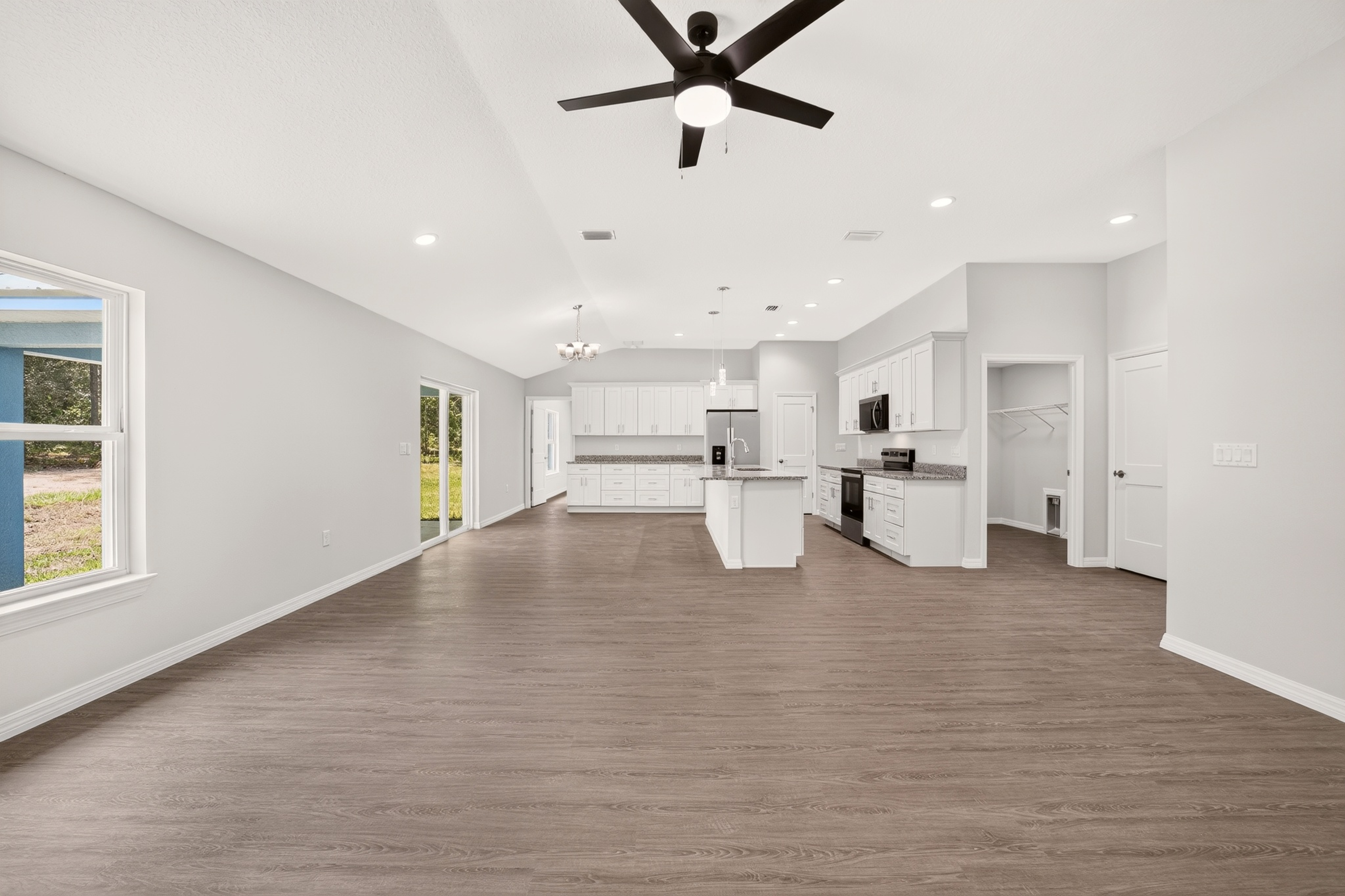 Secondary bedroom showing open closet storage and window in the Timberland 3 bed 2 bath home