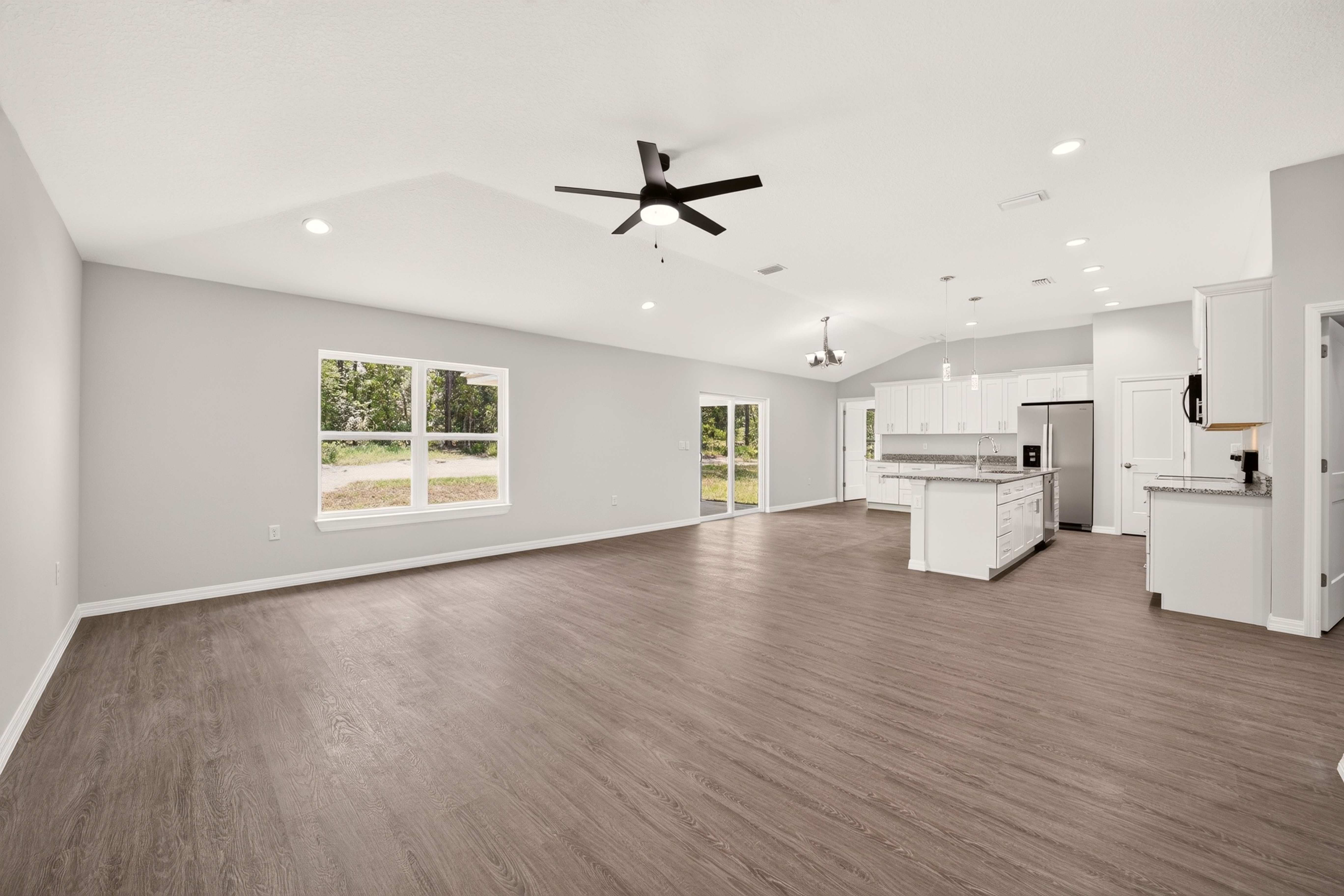 Dedicated home office setup with corner desk and double closet doors in the Timberland style home Florida