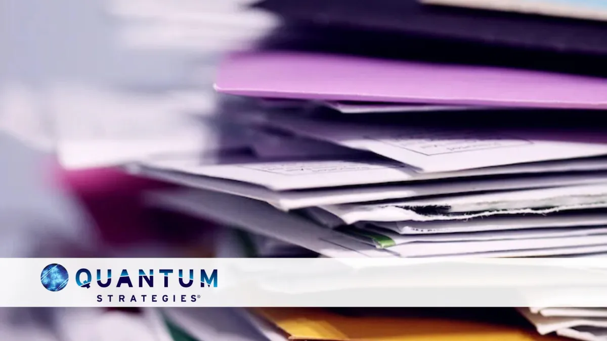 Stack of documents and folders symbolizing the challenges of paperwork management, compliance, and organization in HR transformation, technology, and financial consulting.