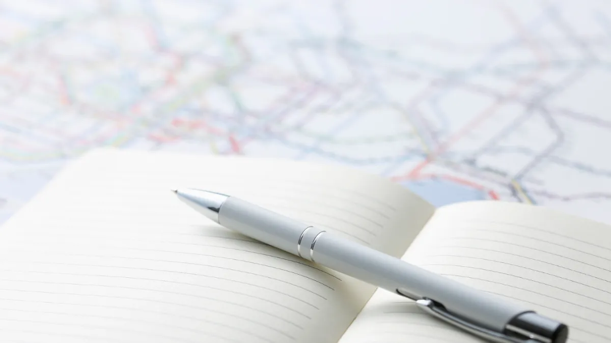 low-angle photography of man in the middle of buidligns