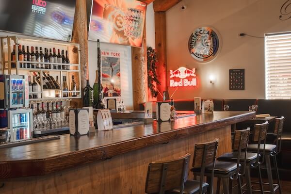 the Cosmopolitan Grill bar, empty bar counter with stools