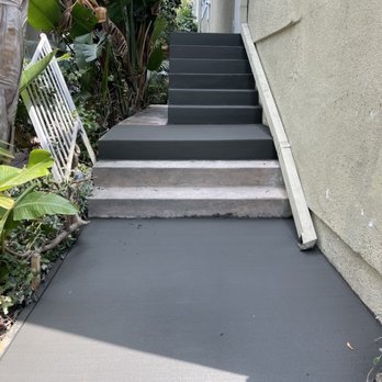Outdoor kitchen with stone BBQ island and built-in grill by Mundo Landscaping in Tucson, AZ — durable and stylish backyard design.