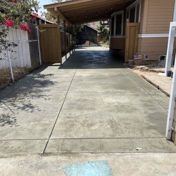 Circular paver patio with built-in fire pit surrounded by greenery — outdoor hardscape project by Mundo Landscaping Tucson, AZ.