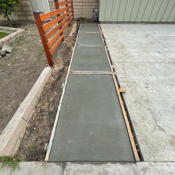 Exterior home painting by Mundo Landscaping in Tucson, AZ — professional painters updating house with durable weather-resistant color.