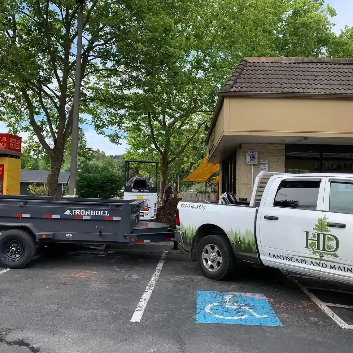 HD Landscape and Maintenance truck and dump trailer at a commercial landscaping job in Portland