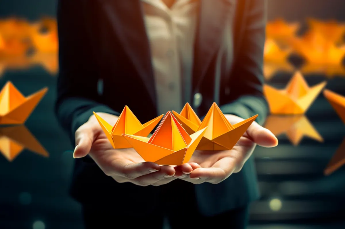 Business professional holding glowing origami-style stars symbolizing high-quality leads.